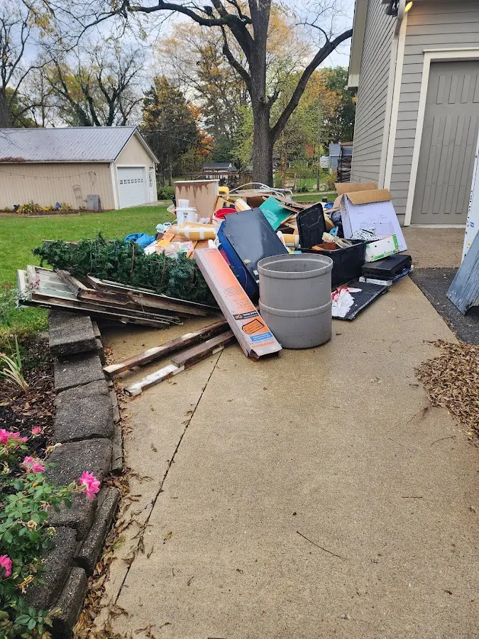 Dumpster being loaded with debris for Demolition Dumpster Rental in Canton